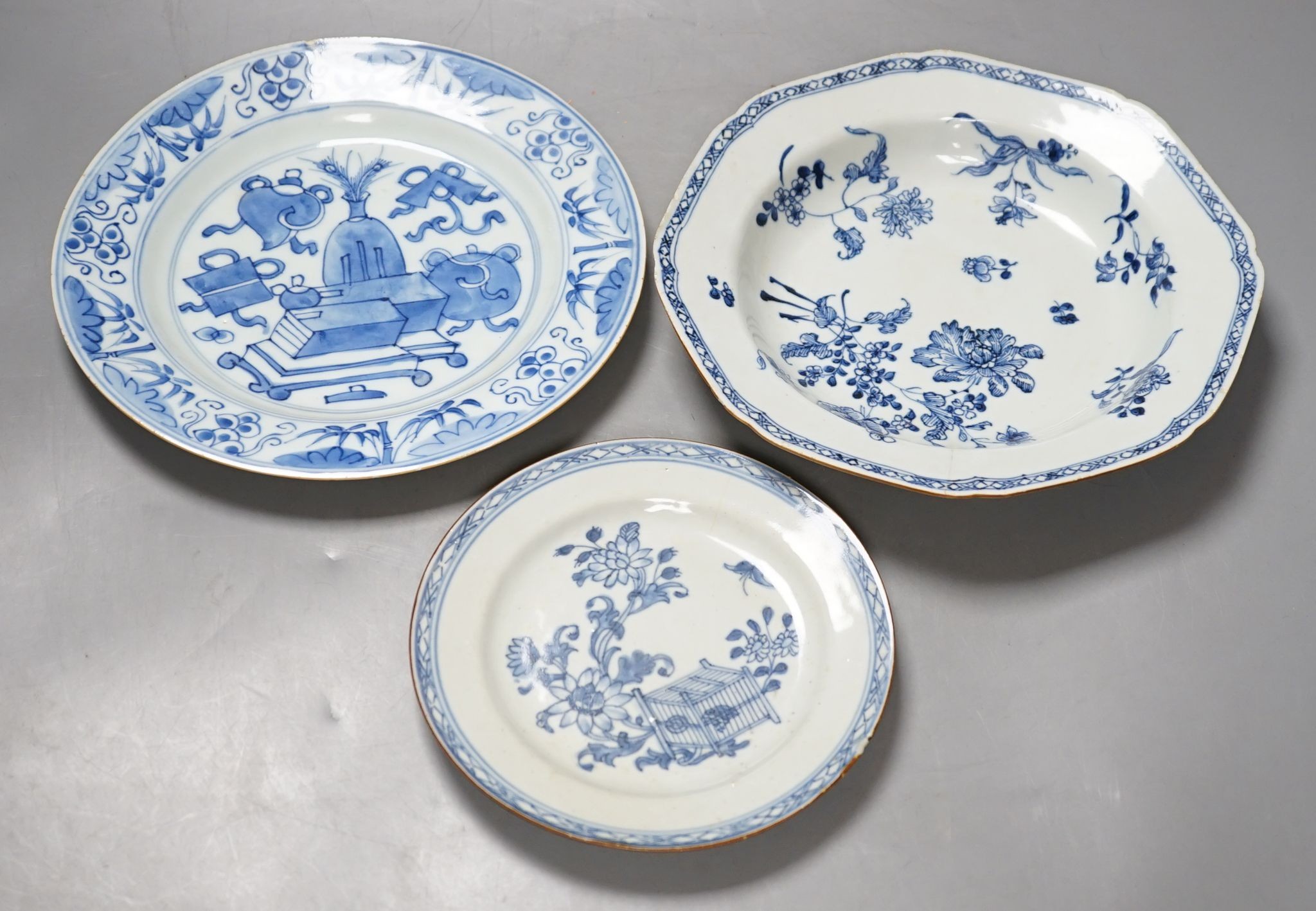 A Set of six 18th century Chinese export blue and white ‘bird in a cage’ small plates, 6.3 cm diameter and two pairs of 18th century Chinese export blue and white plates dishes, largest 23cm diam (10)